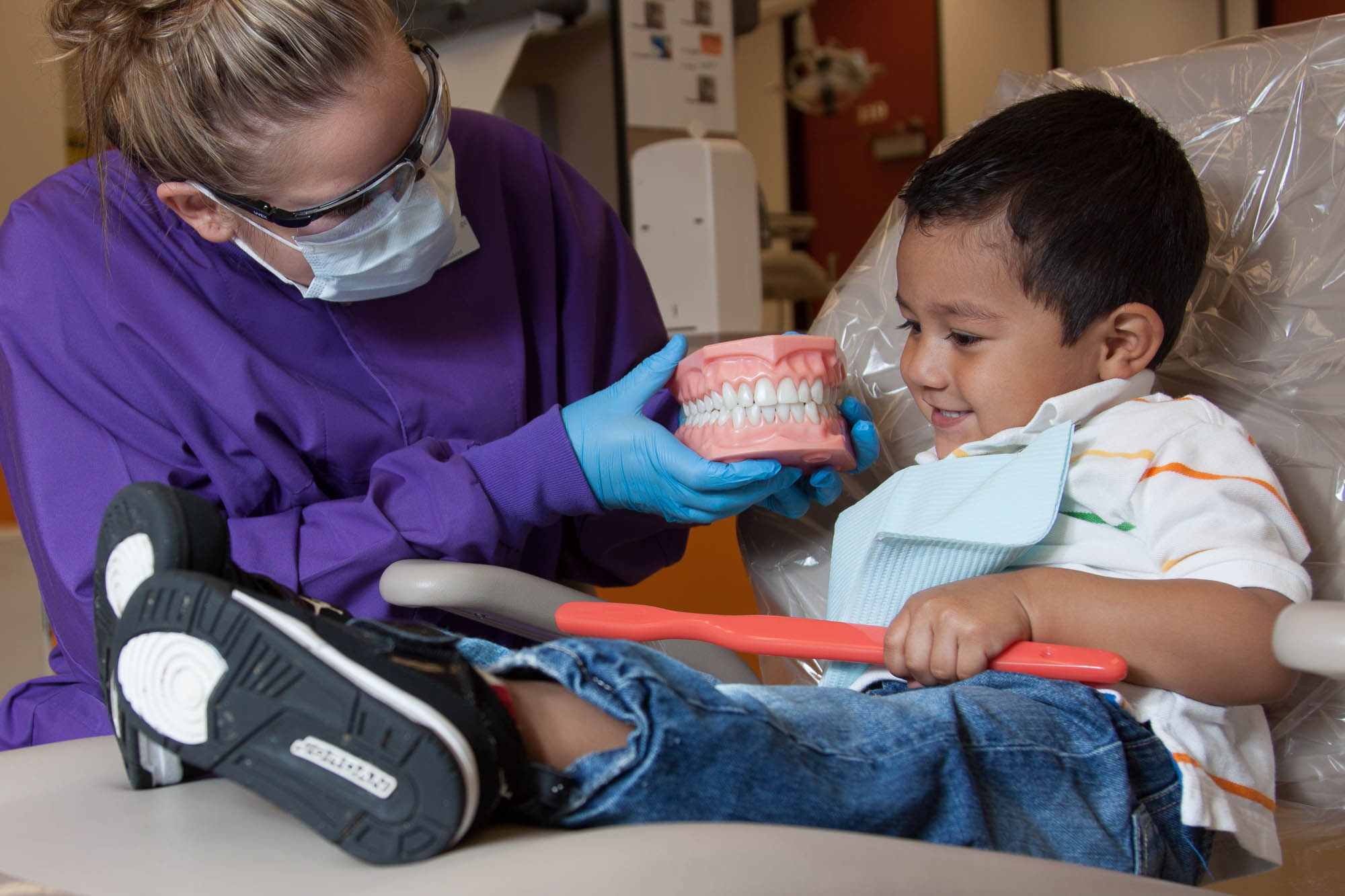 Dental student with a child patient